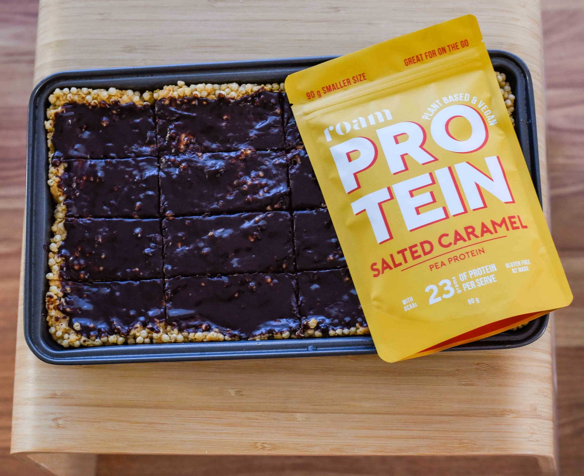 Salted Caramel Protein Bars with chocolate and packet of Roam Salted Caramel Protein